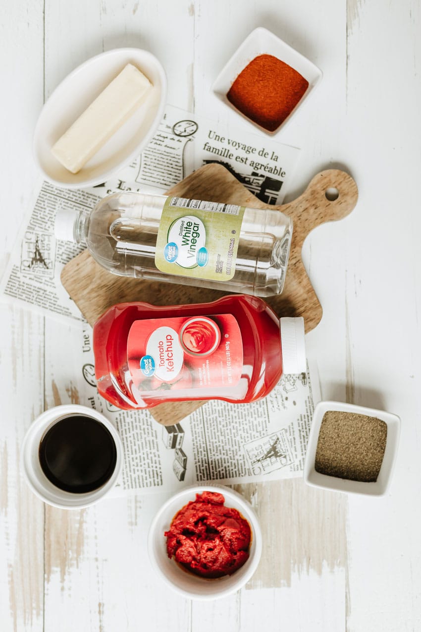 an overhead image showing the measured ingredients needed to make a homemade barbecue sauce