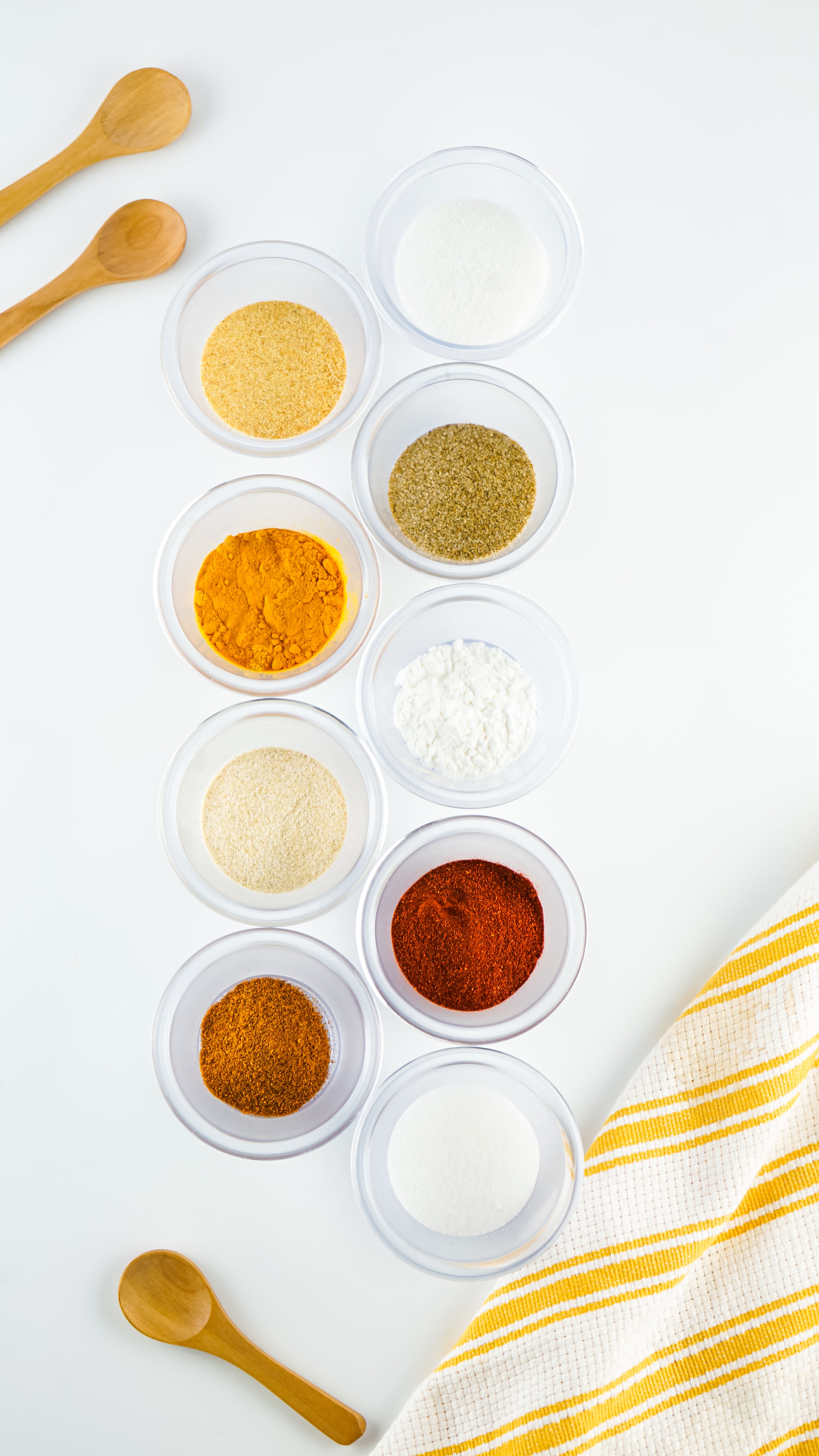an overhead image showing the measured ingredients needed to make a batch of homemade lawry's seasoned salt