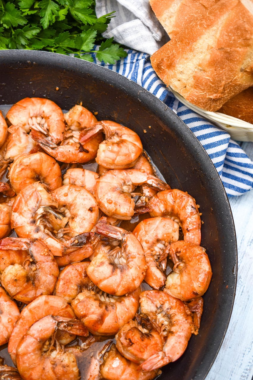 new orleans barbecue shrimp in a large black skillet