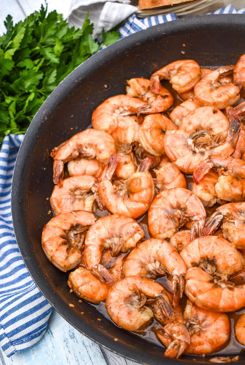 new orleans barbecue shrimp in a large black skillet
