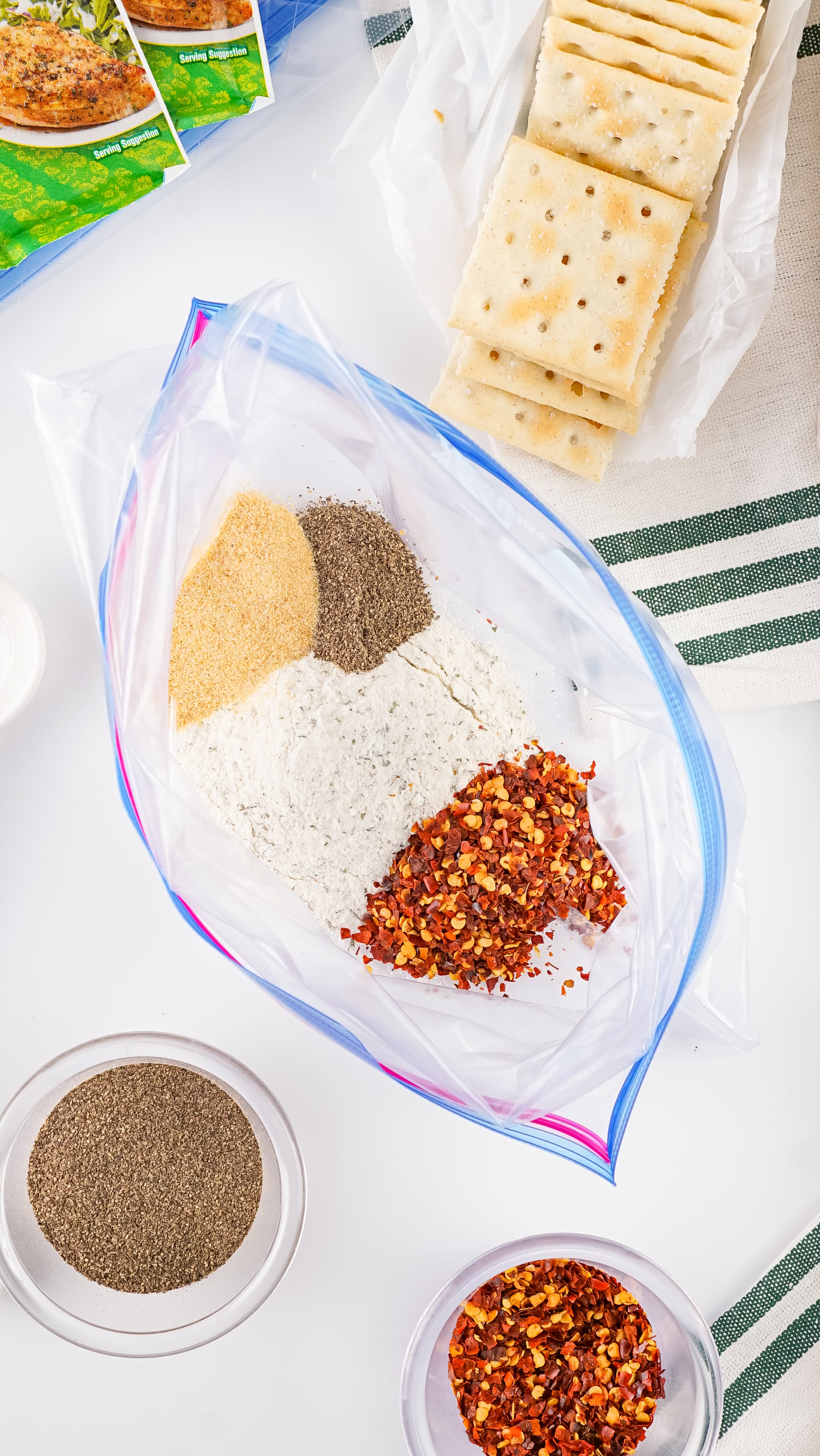 seasonings in the bottom of a large ziplocking bag