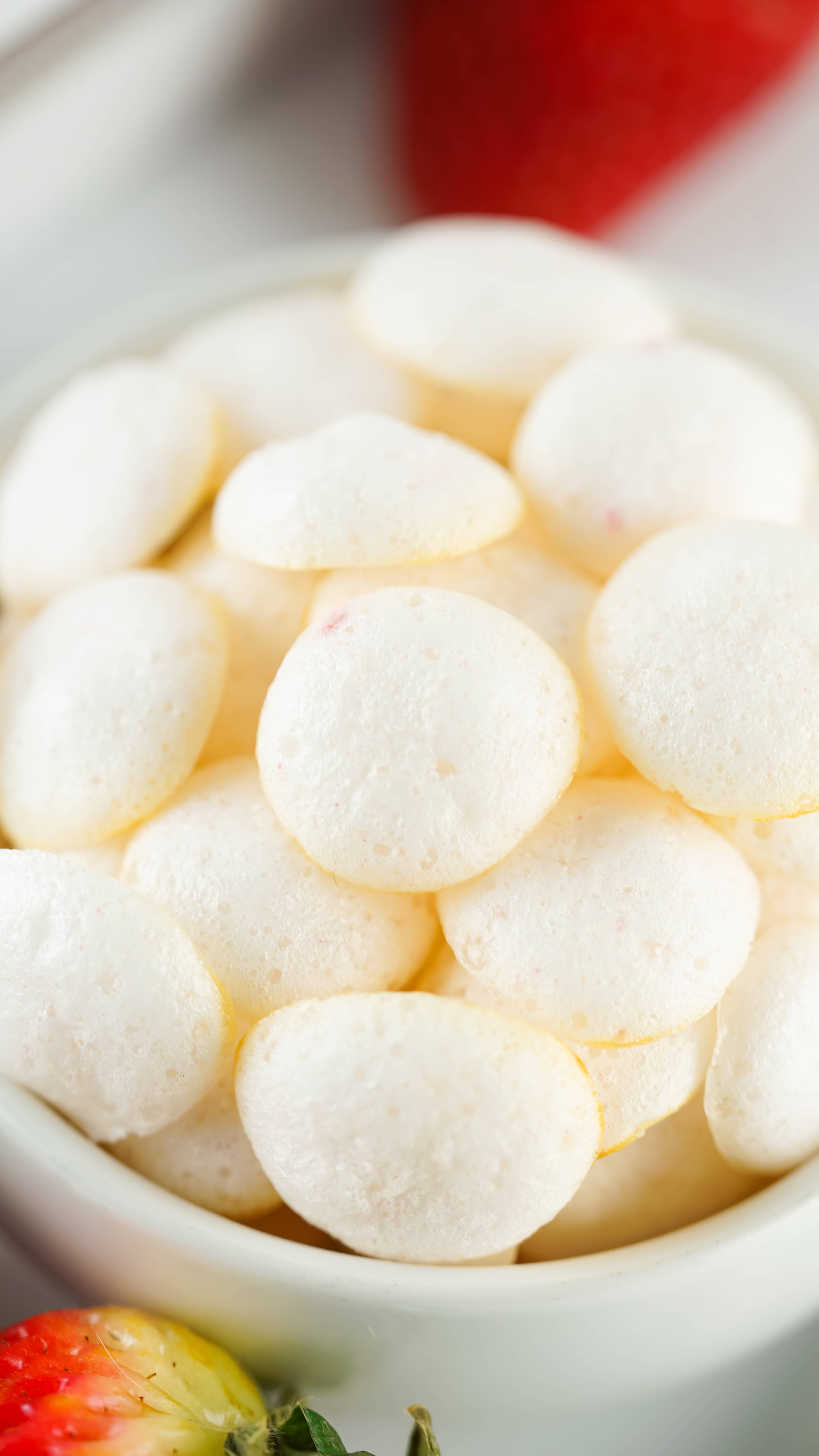 a close up of homemade yogurt melts in a small white bowl