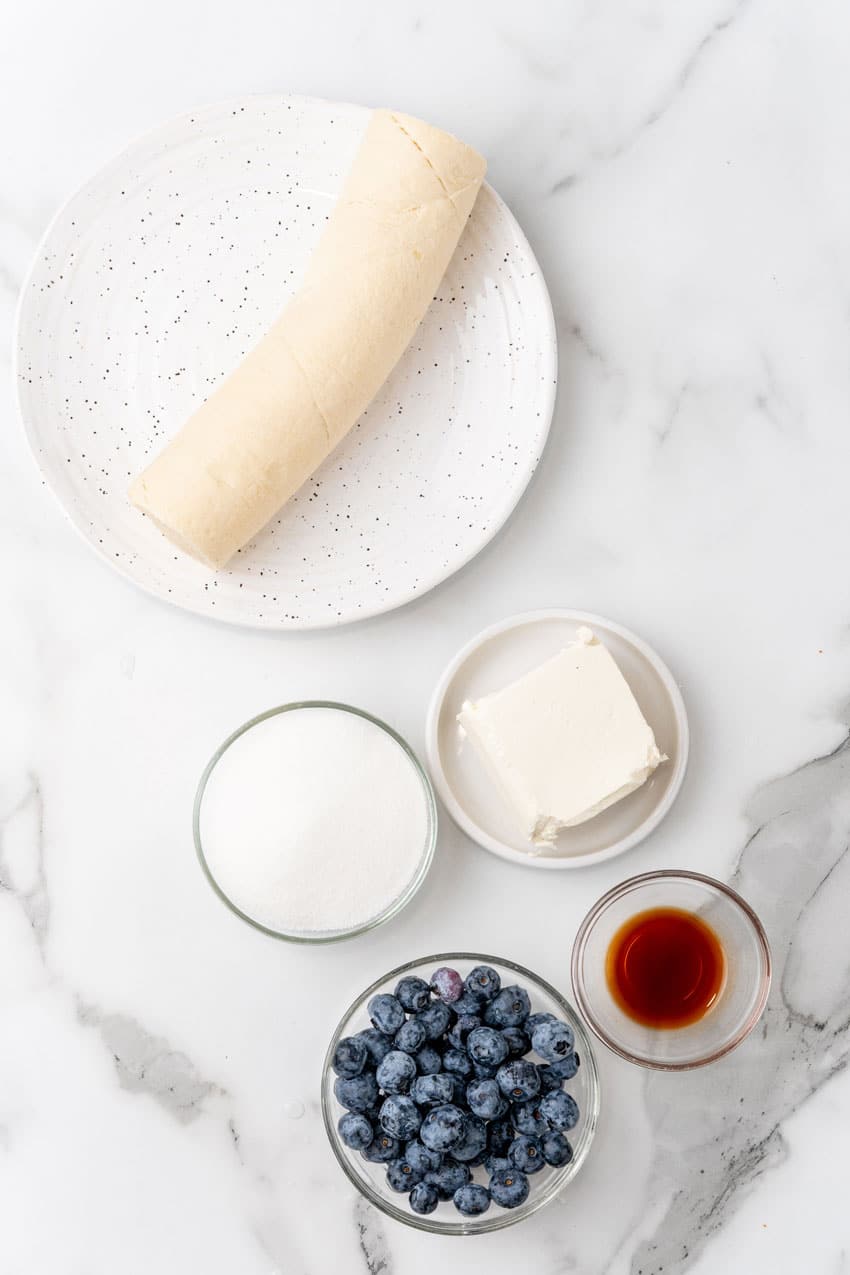 an overhead image showing the measured ingredients needed to make a batch of blueberry cream cheese danish