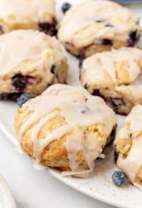 copycat glazed bo-berry biscuits on a white serving platter