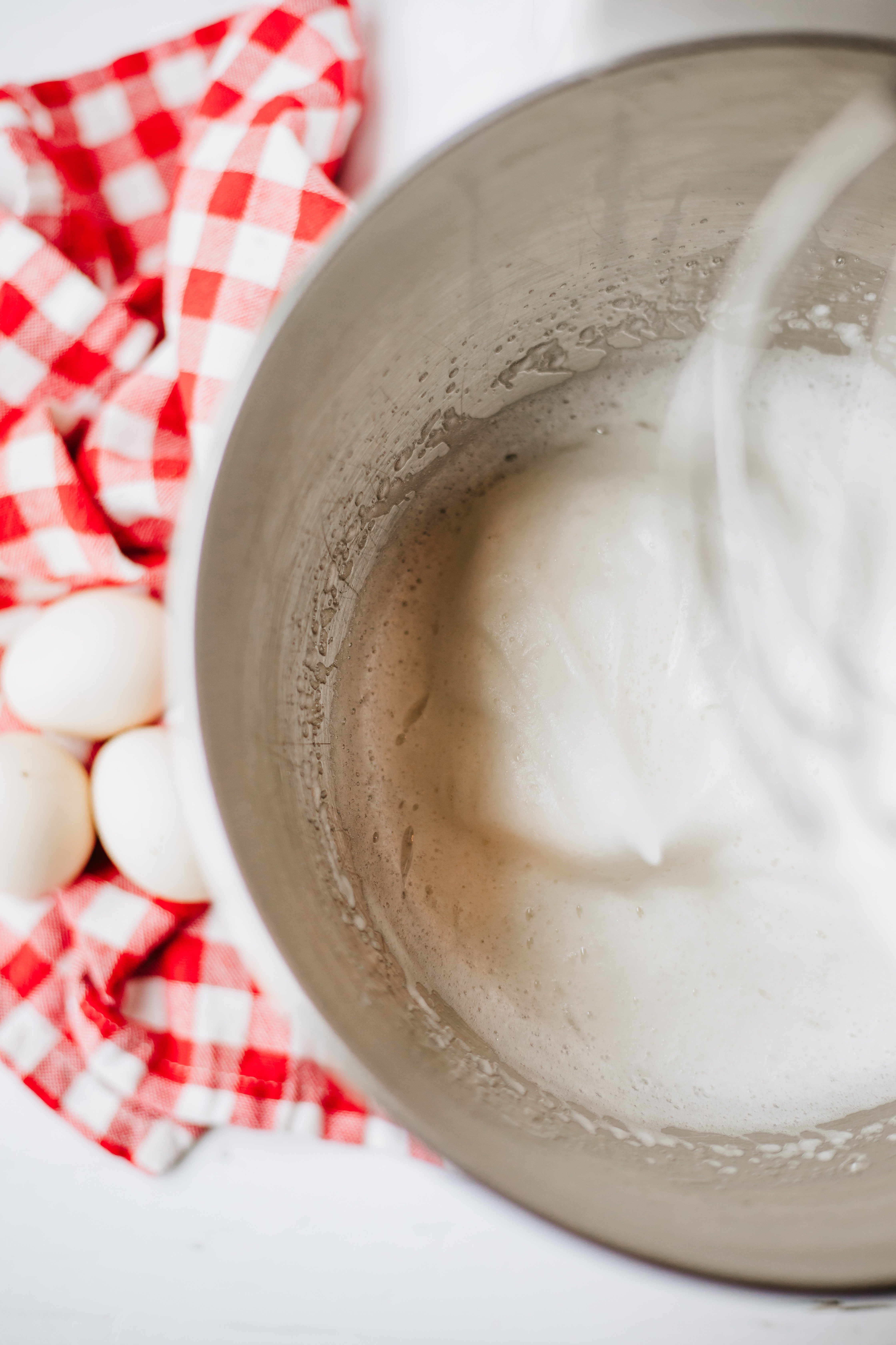 homemade marshmallow fluff batter in a metal mixing bowl