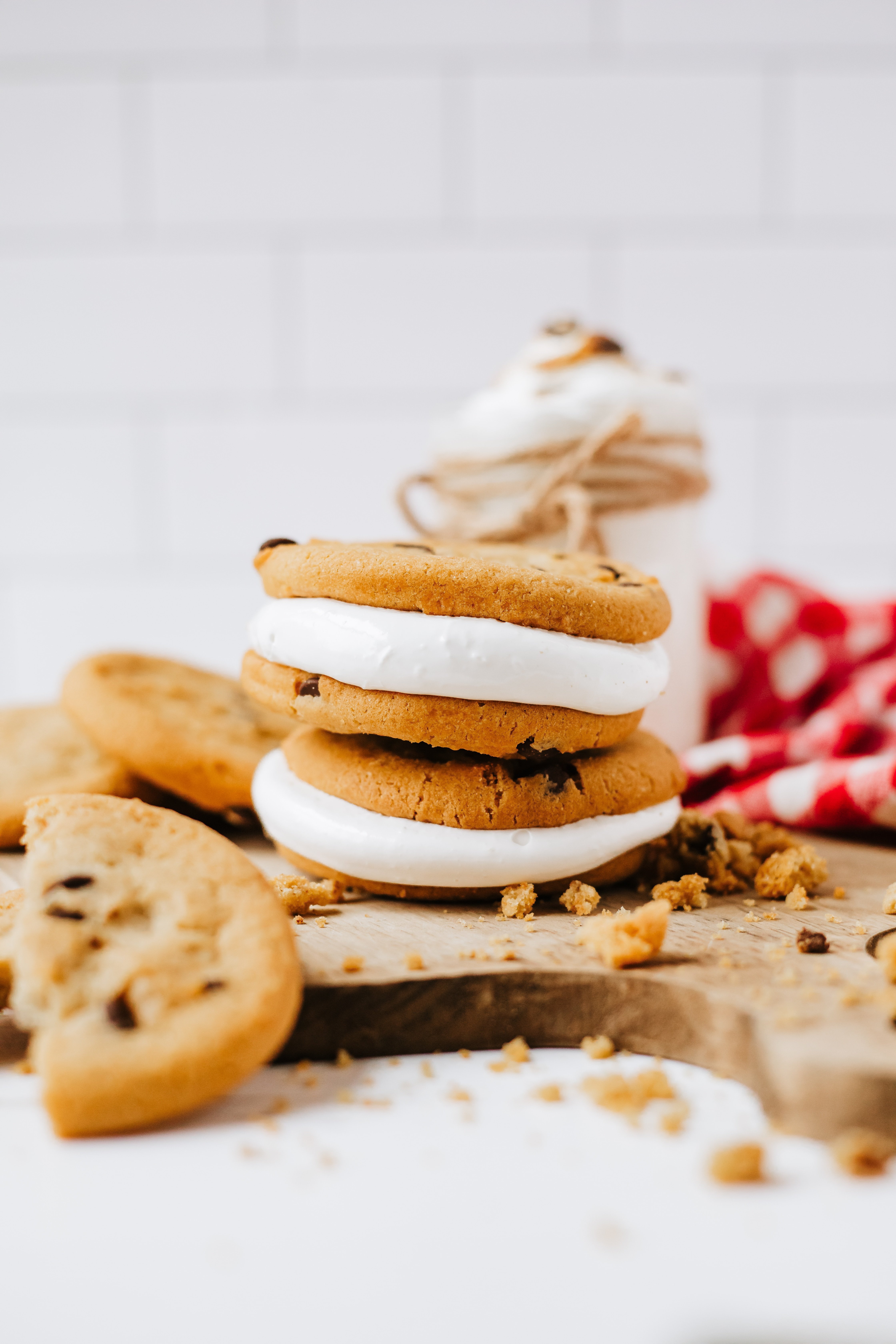 homemade marshmallow fluff in a glass jar on a wooden countertop