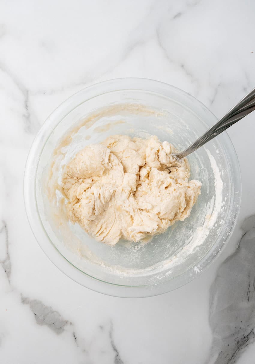 flour tortilla dough in a glass mixing bowl