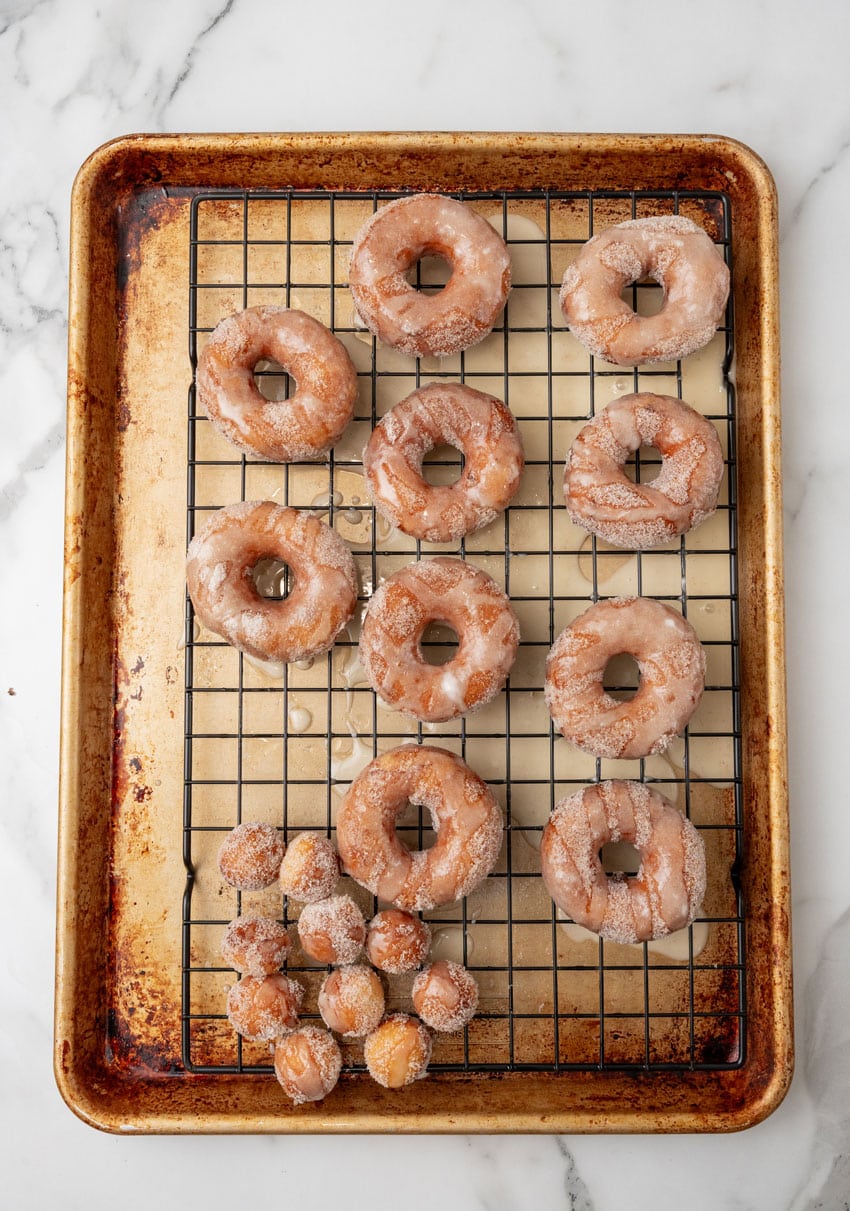 glazed cinnamon sugared donuts on a wire rack
