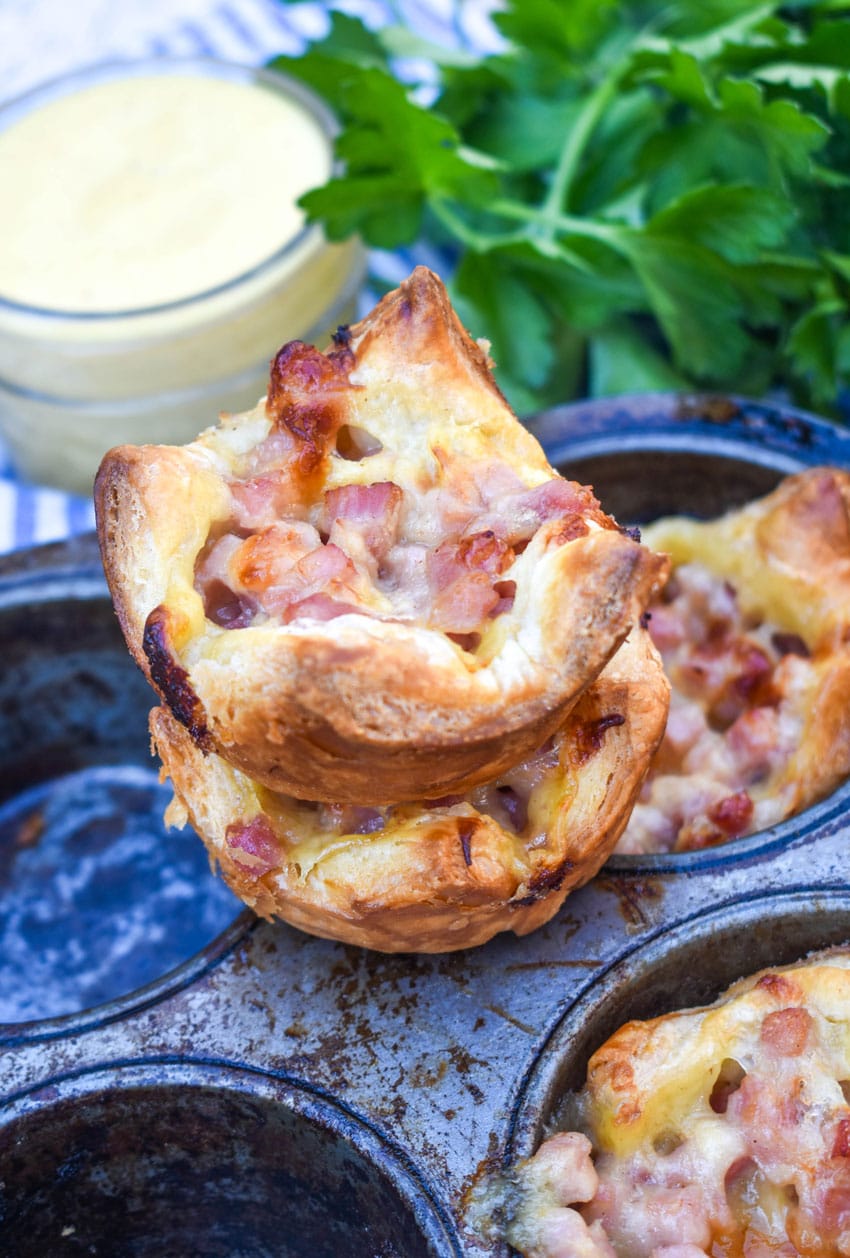 monte cristo puff pastry bites in a metal muffin tin