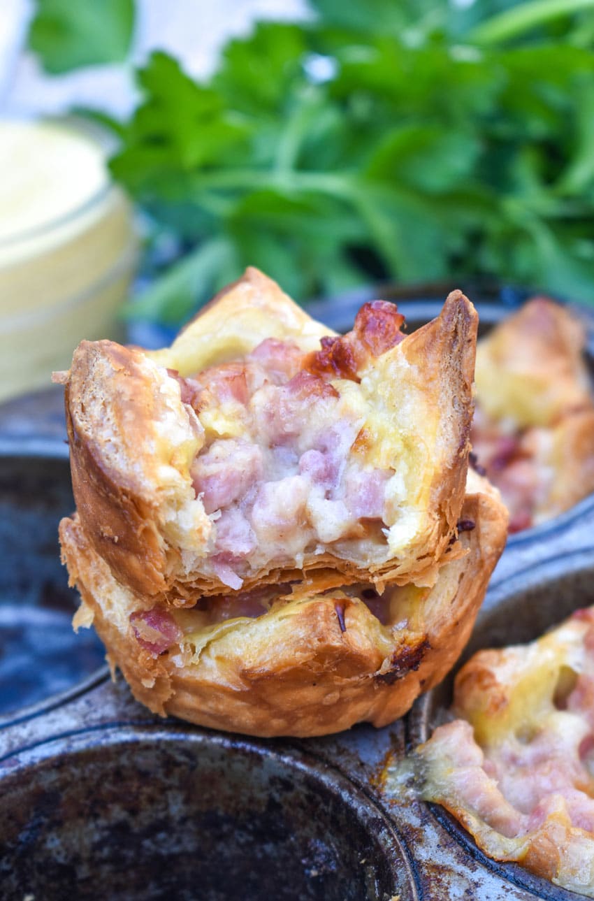 monte cristo puff pastry bites in a metal muffin tin