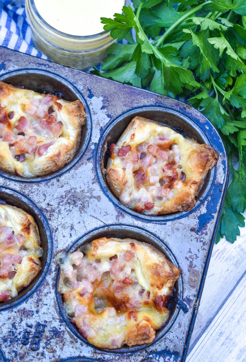 monte cristo puff pastry bites in a metal muffin tin
