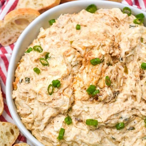 slow cooker creamy crab dip in a large white bowl
