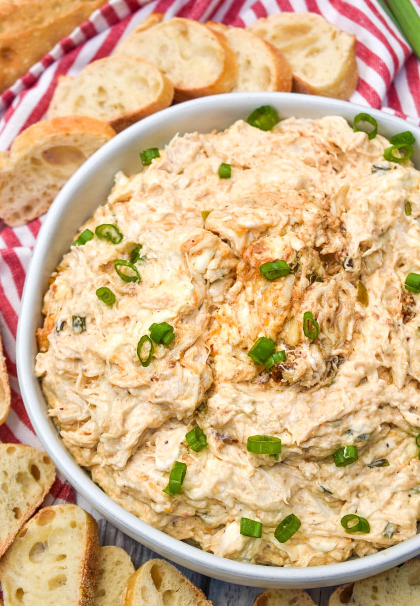 slow cooker creamy crab dip in a large white bowl