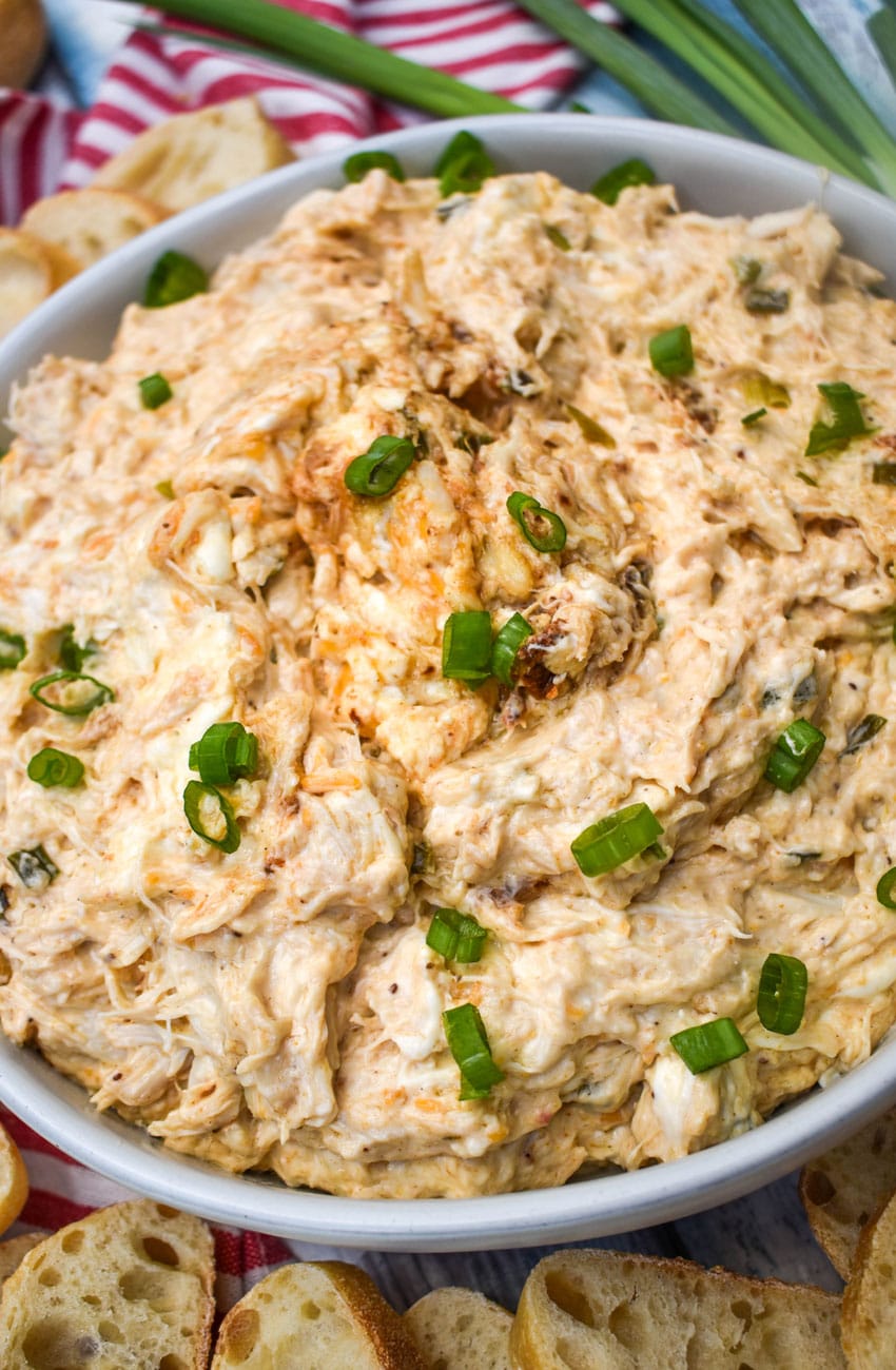 slow cooker creamy crab dip in a large white bowl
