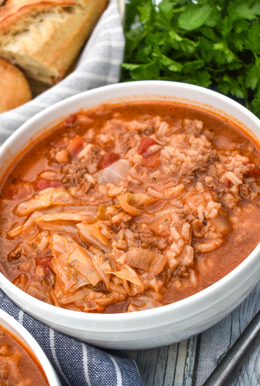 unstuffed cabbage soup in two white bowls