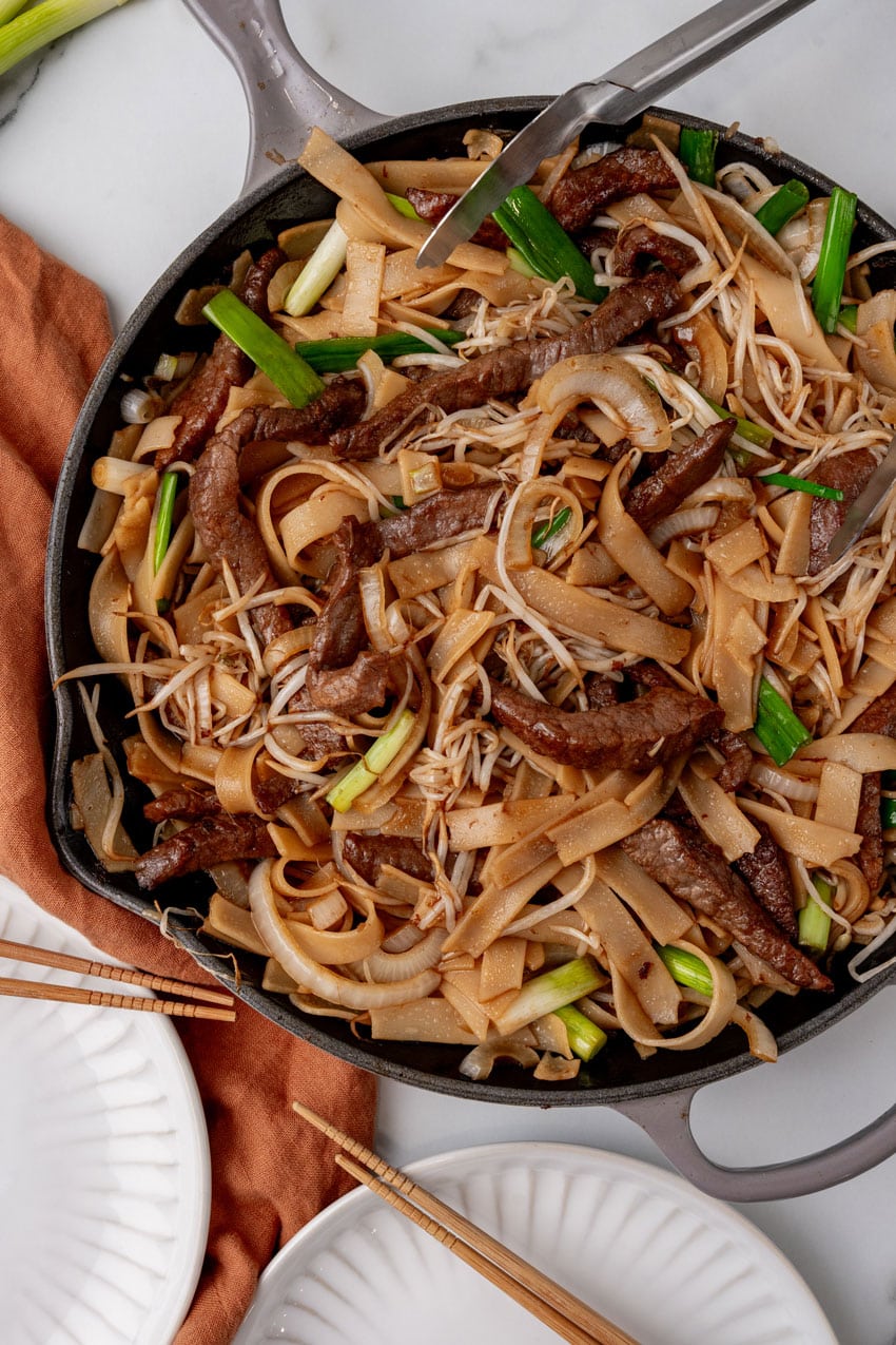 beef chow fun in a large gray skillet