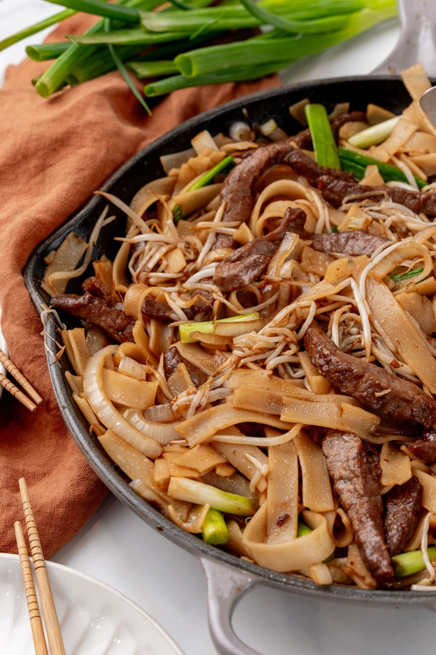 beef chow fun in a large gray skillet