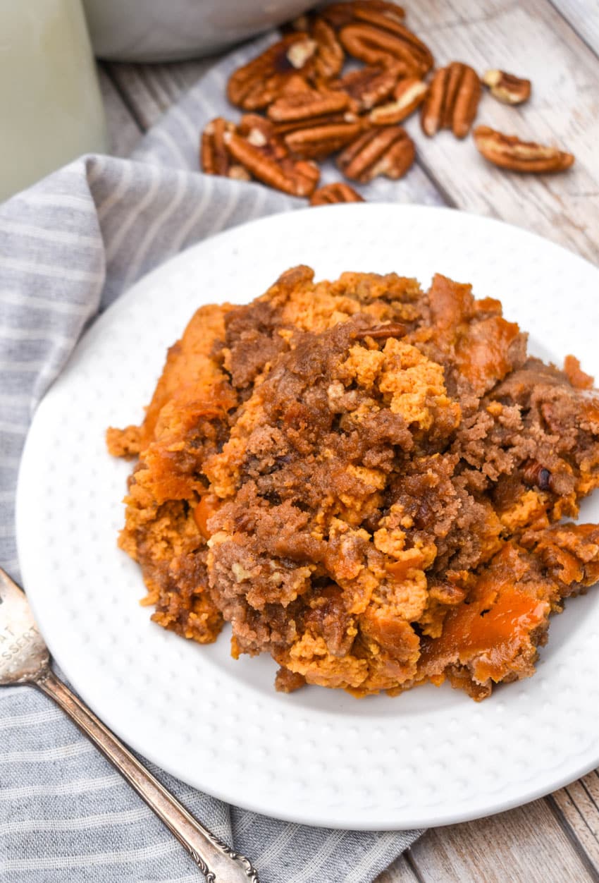 pumpkin pecan dump cake on a small white plate