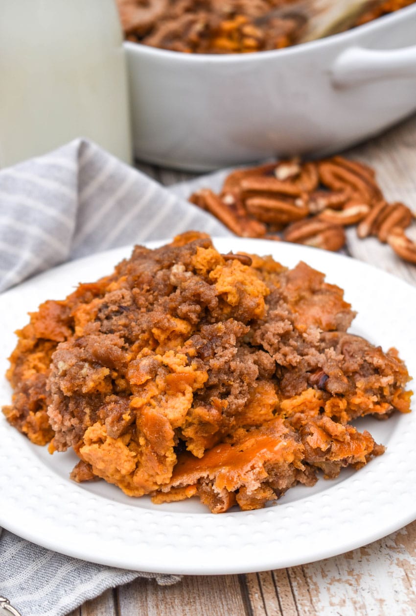 pumpkin pecan dump cake on a small white plate