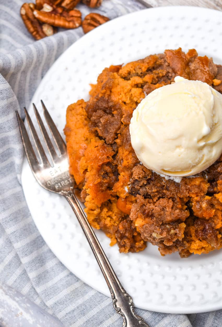 pumpkin pecan dump cake on a small white plate
