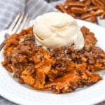 pumpkin pecan dump cake on a small white plate
