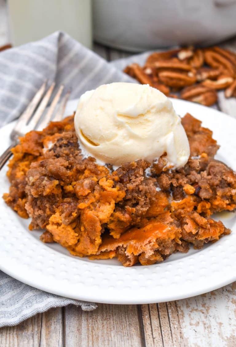 pumpkin pecan dump cake on a small white plate