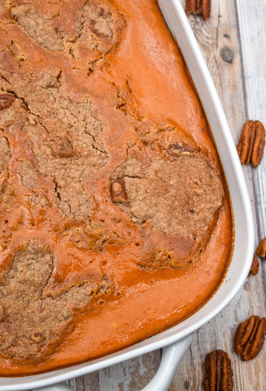 pumpkin pecan dump cake in a white baking dish