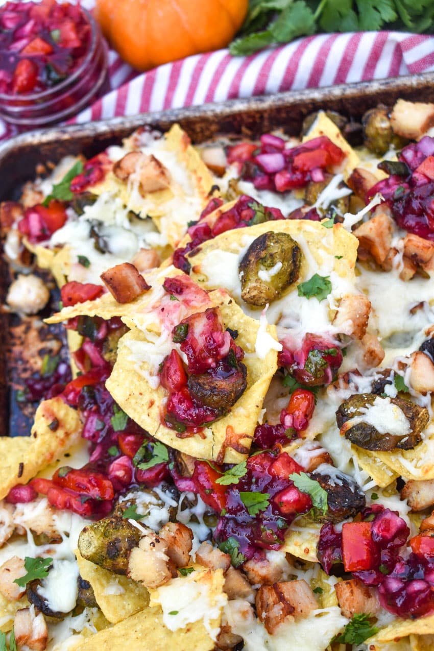 a close up of thanksgiving nachos on a metal baking pan