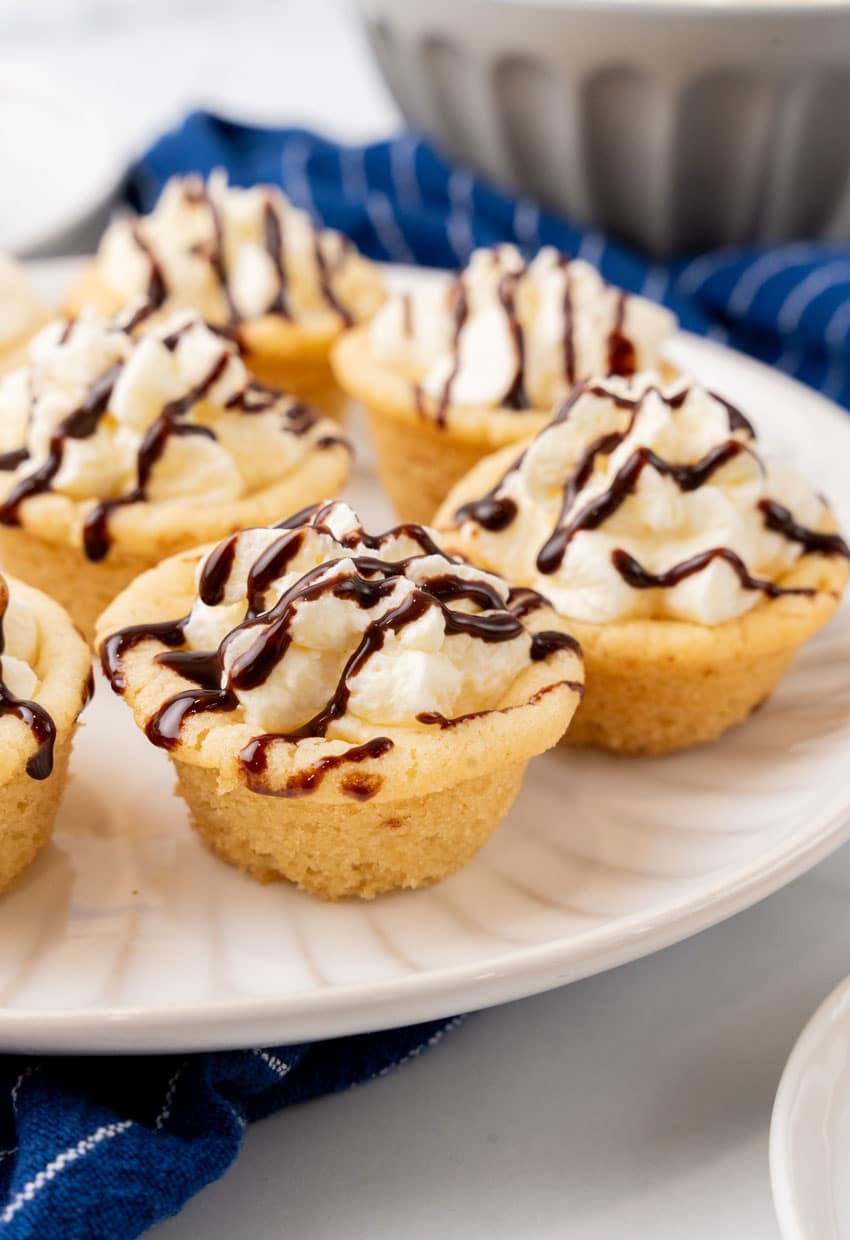 boston cream pie cookie cups on a white serving plate