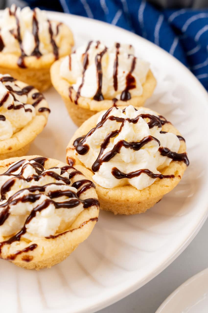 boston cream pie cookie cups on a white serving plate