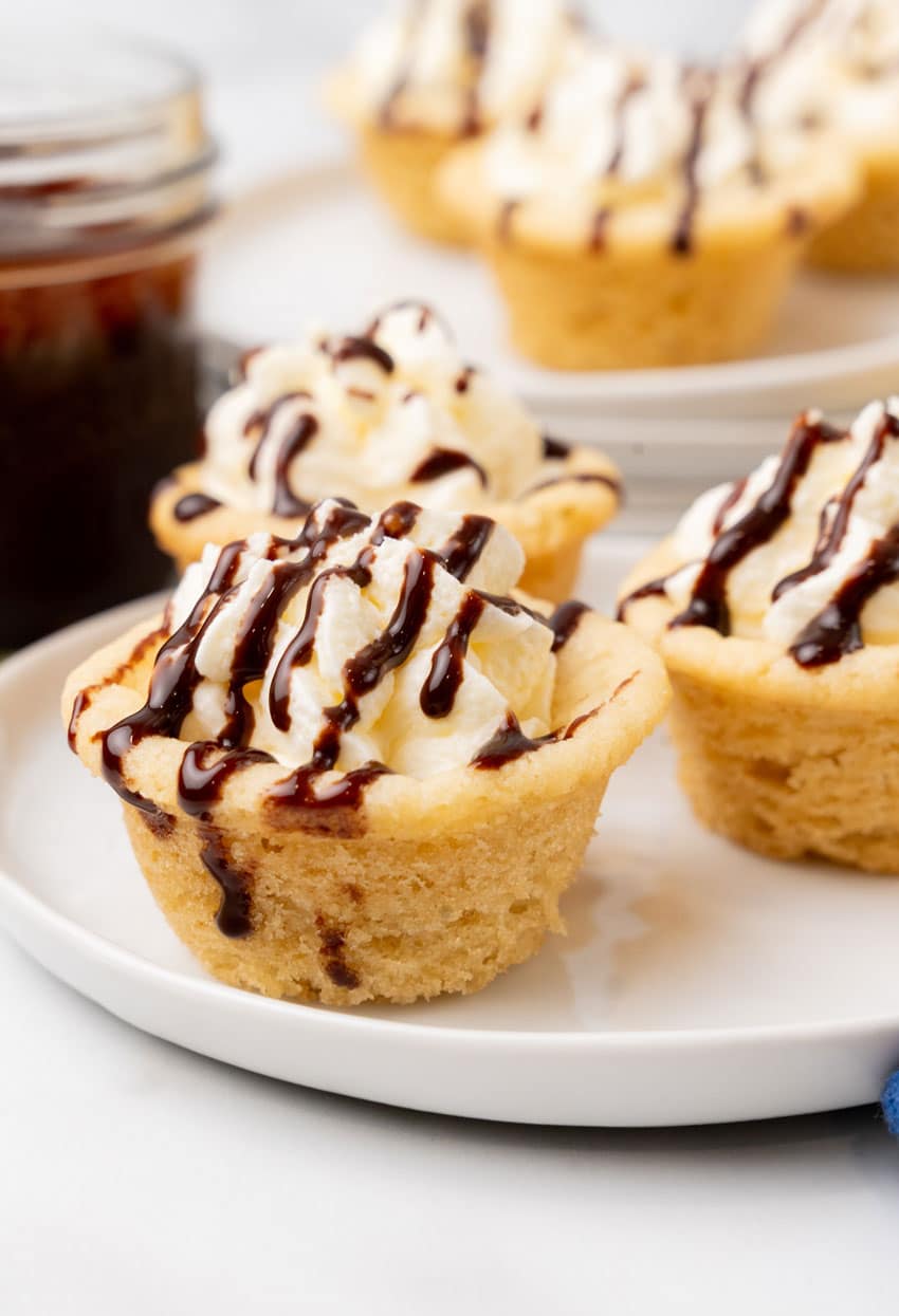 boston cream pie cookie cups on a white serving plate