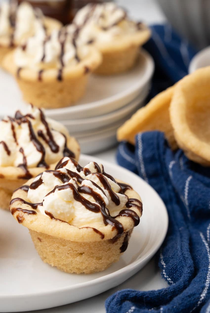 boston cream pie cookie cups on a white serving plate