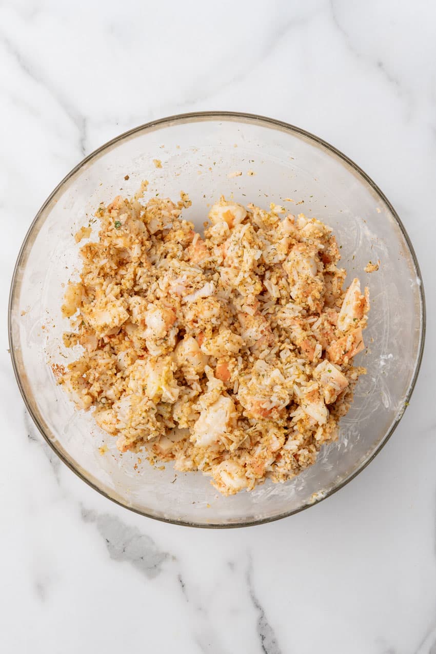 seafood stuffing mixture in a glass mixing bowl