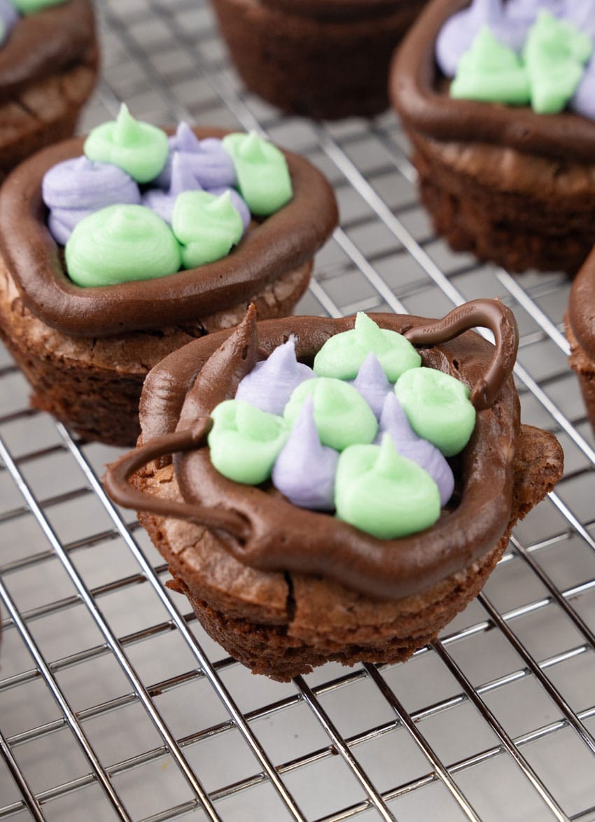 chocolate cauldron cupcakes on a wire baking rack