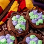 a close up of harry potter cauldron cupcakes