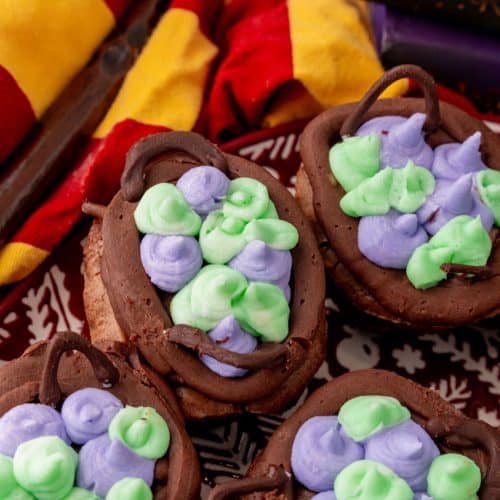 a close up of harry potter cauldron cupcakes