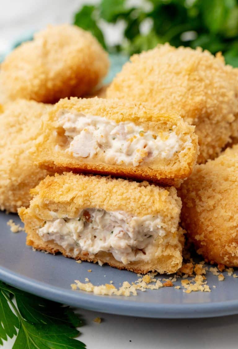 crispy chicken pillows piled on a gray plate