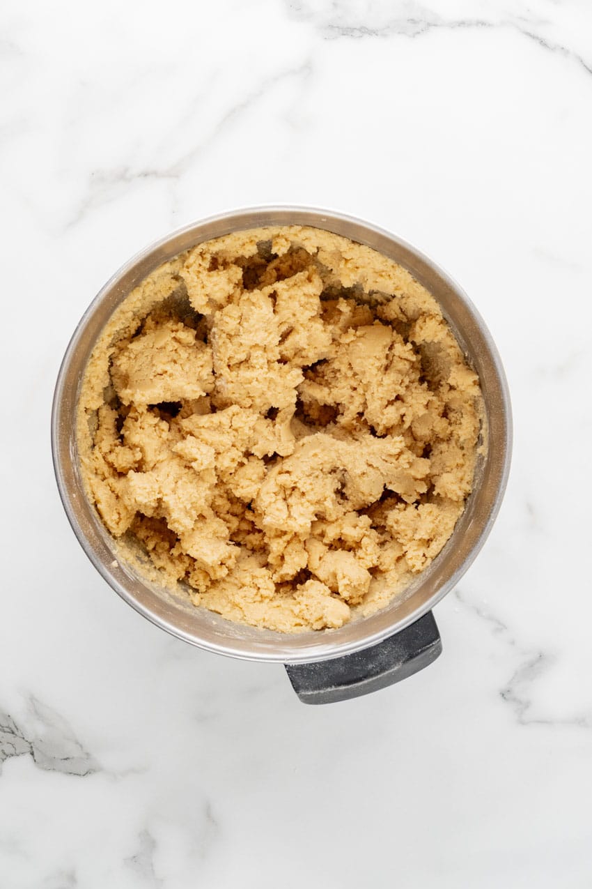homemade sugar cookie dough in a metal mixing bowl