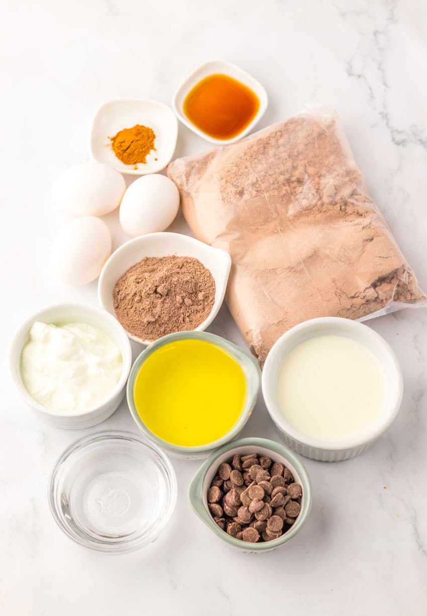 an overhead image showing the measured ingredients needed to make a batch of double chocolate chunk muffins