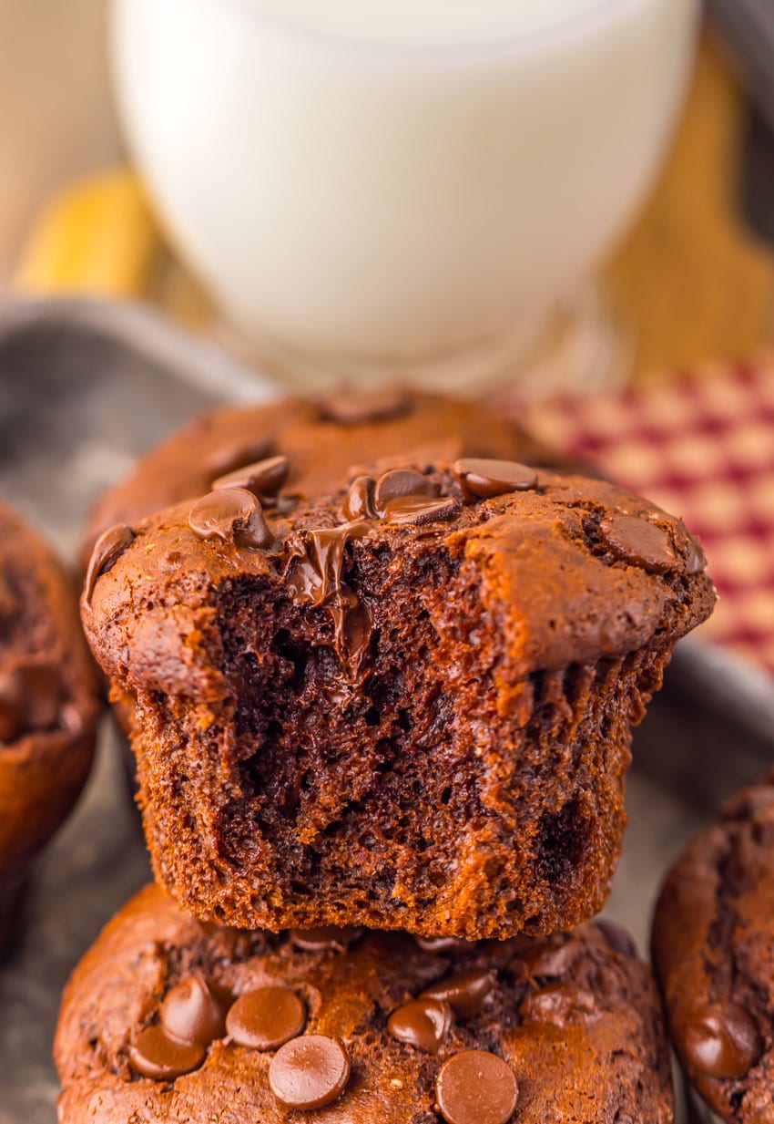 a close up of double chocolate chunk muffins on a metal tray