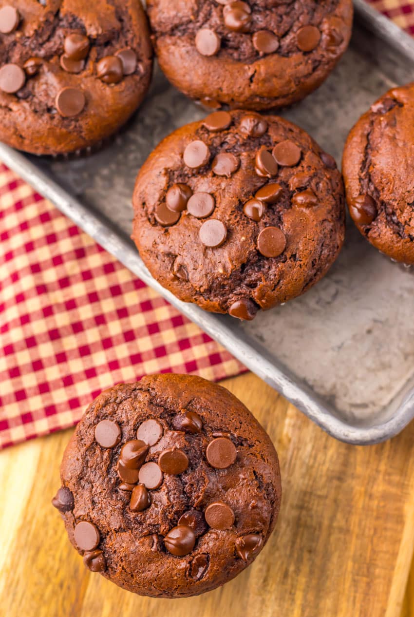 double chocolate chunk muffins on a metal tray