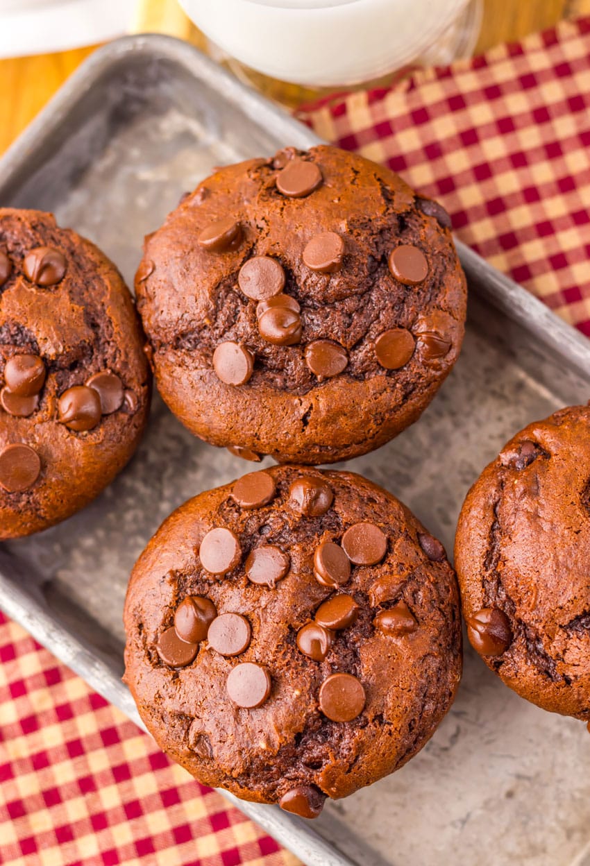 double chocolate chunk muffins on a metal tray