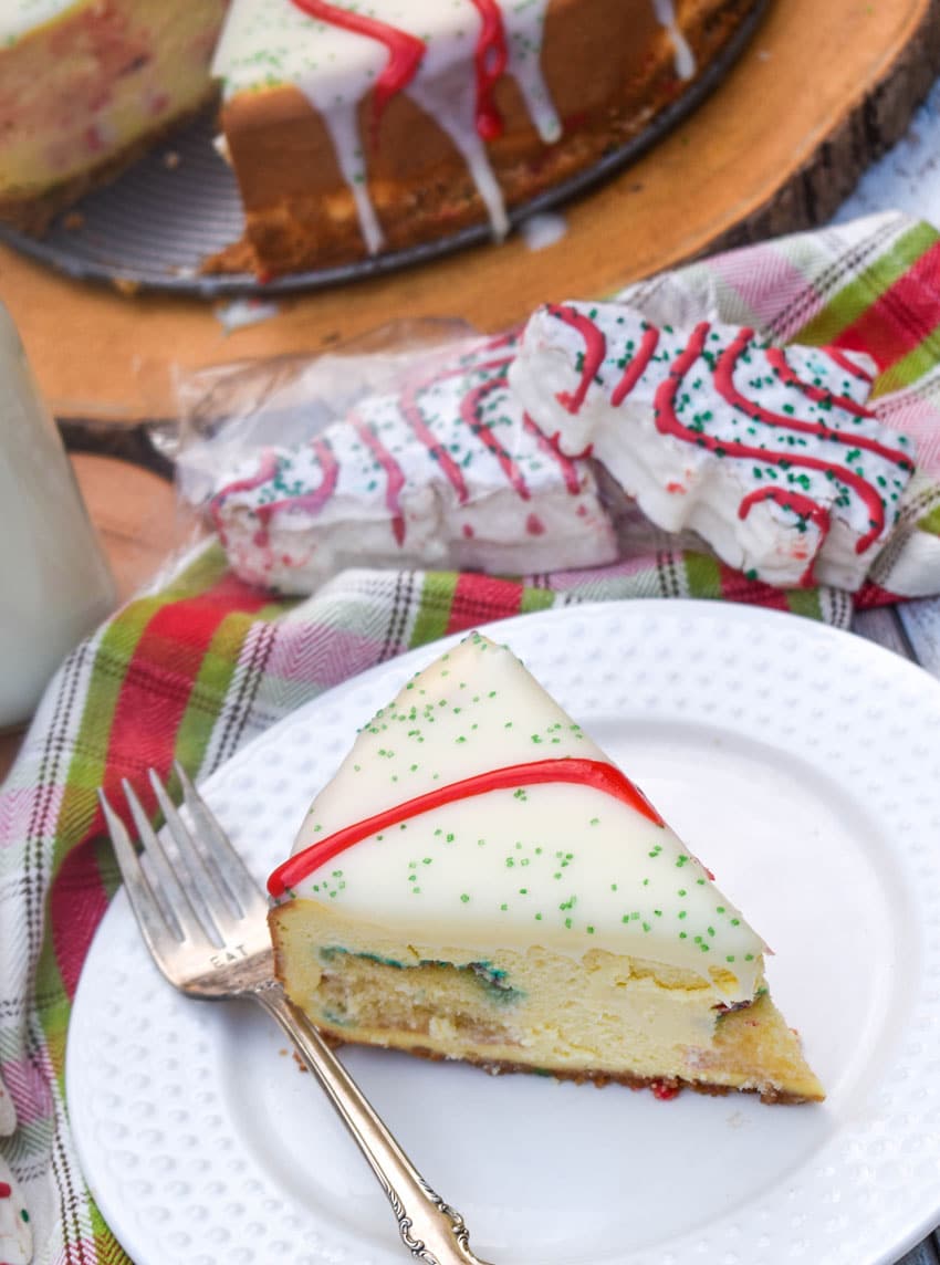a slice of little debbie christmas tree cheesecake on a small white plate