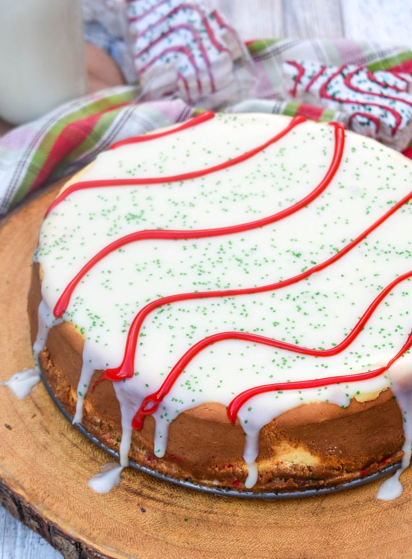 a little debbie christmas tree cheesecake on a wooden cutting board