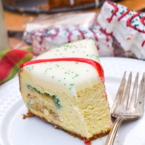 a slice of little debbie christmas tree cheesecake on a small white plate