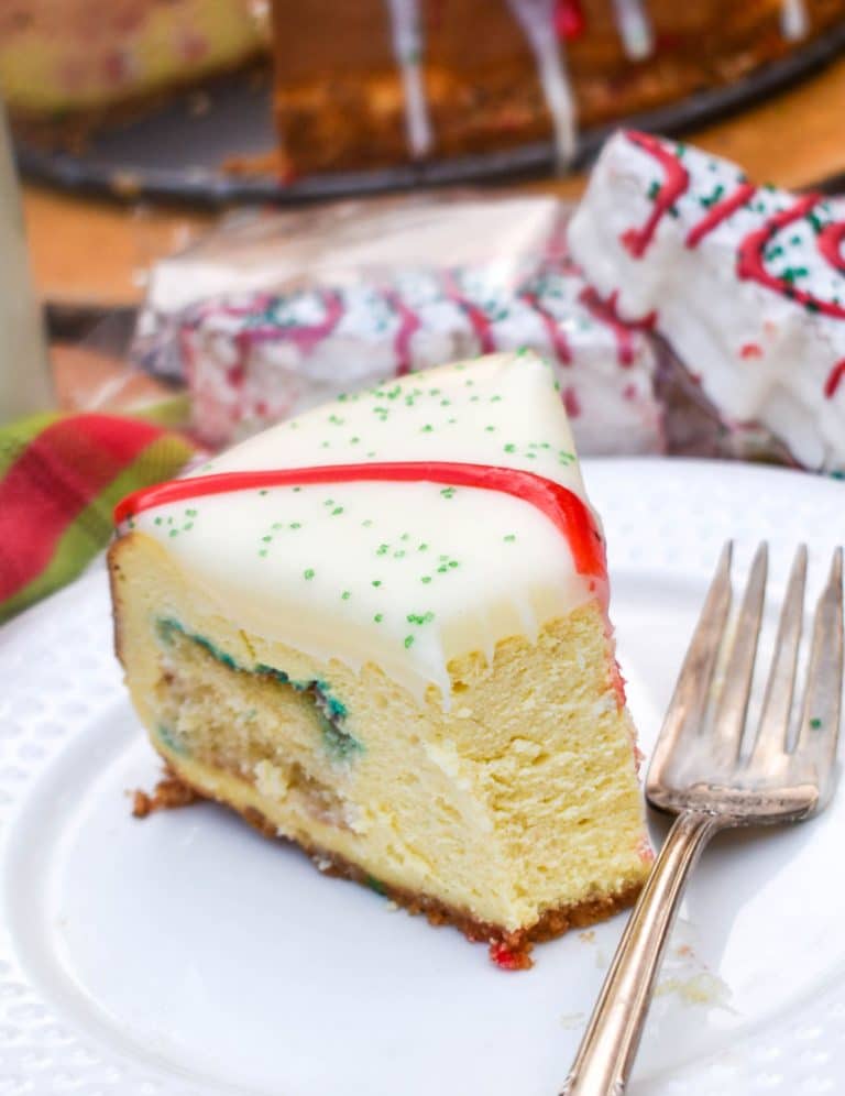 a slice of little debbie christmas tree cheesecake on a small white plate