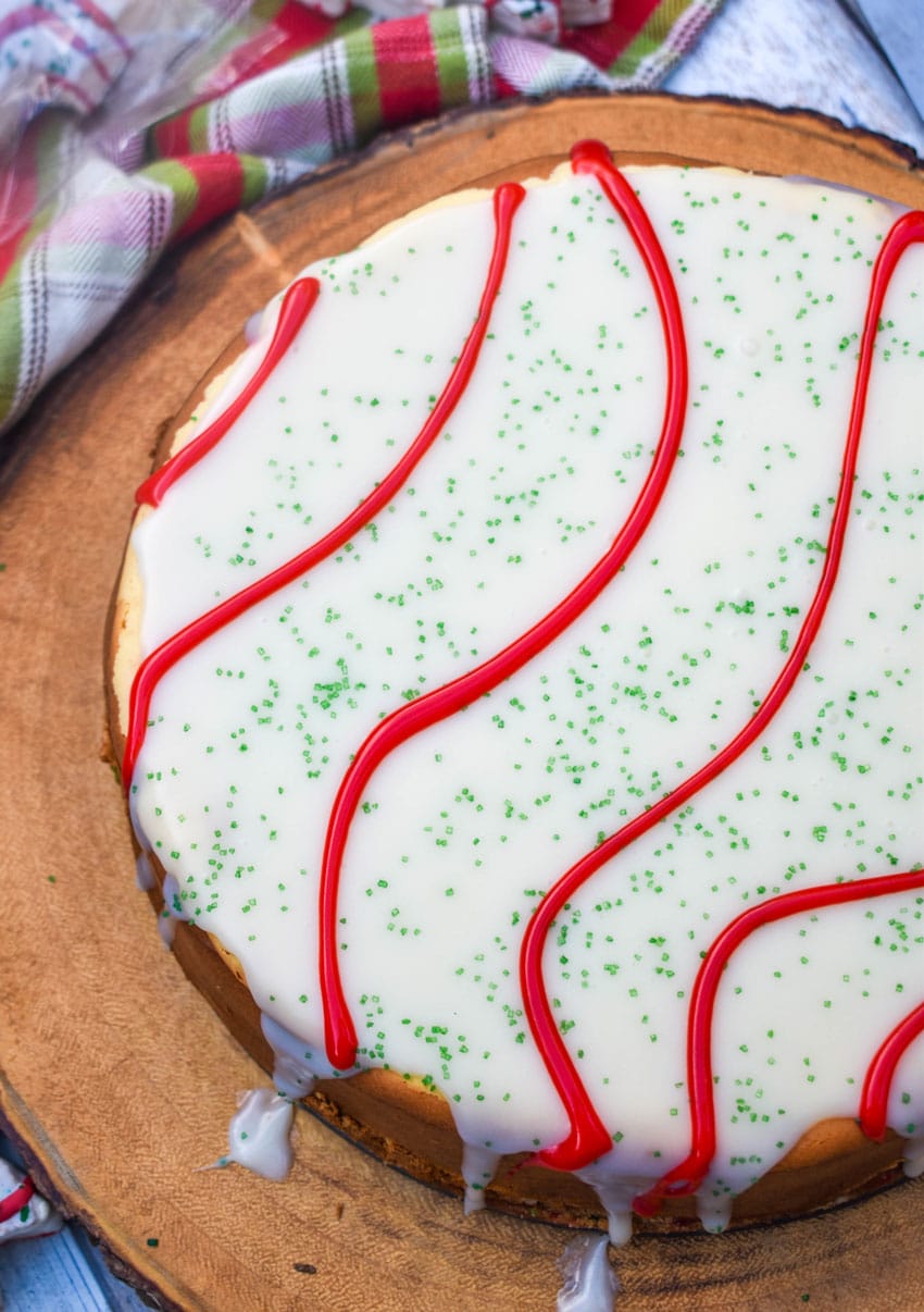 a little debbie christmas tree cheesecake on a wooden cutting board