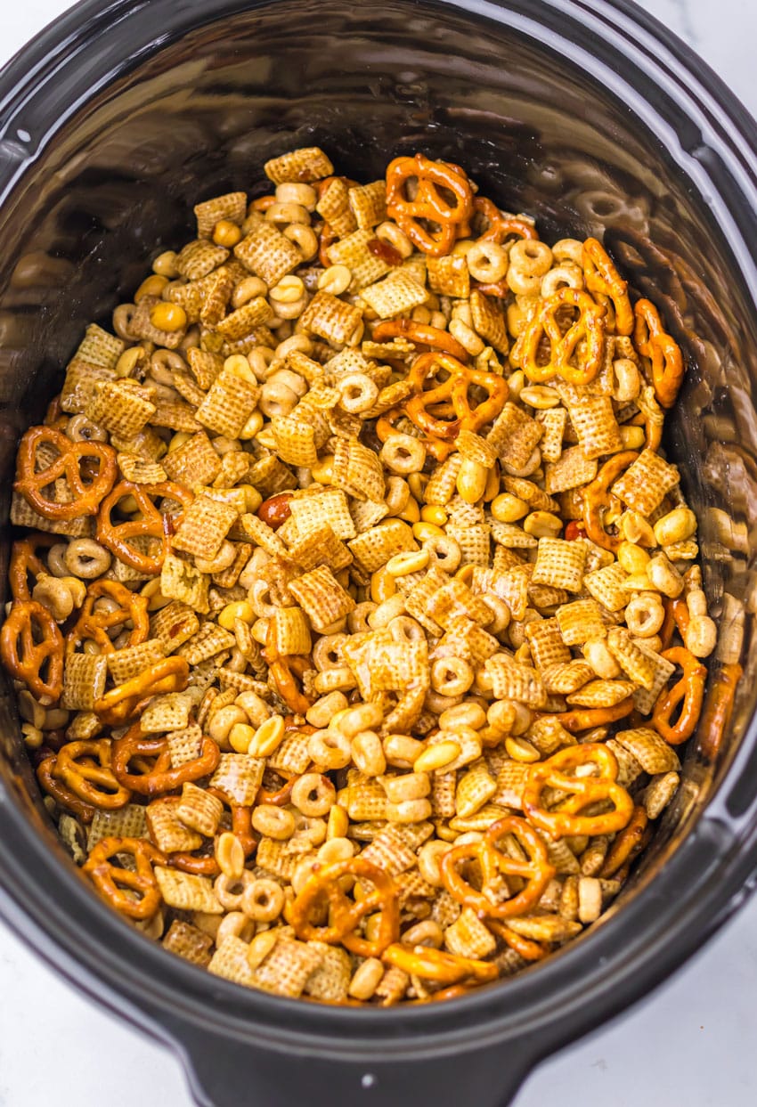 homemade christmas chex mix in a black crockpot