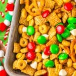 slow cooker christmas chex mix in a metal tray