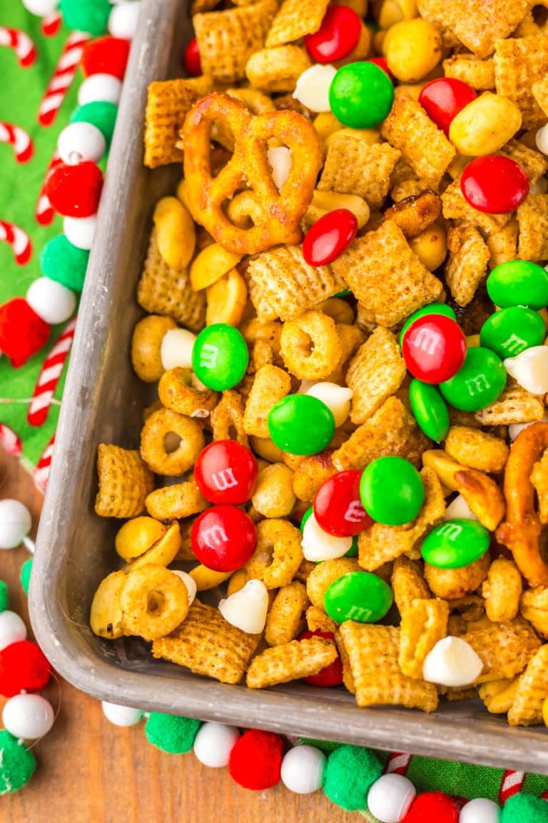 slow cooker christmas chex mix in a metal tray